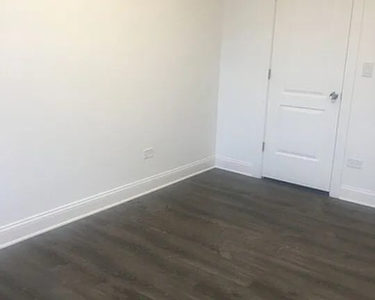 1524 North Ashland Avenue Chicago, IL 60622 - Photo 15 of 38 an empty room with wooden floor