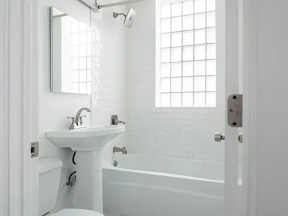 a view of storage and utility room with washer and dryer