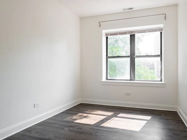 1524 North Ashland Avenue Chicago, IL 60622 - Photo 19 of 38 an empty room with wooden floor and windows