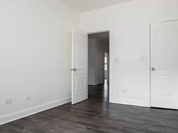 1524 North Ashland Avenue Chicago, IL 60622 - Photo 21 of 38 an empty room with wooden floor & closet