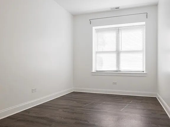 1524 North Ashland Avenue Chicago, IL 60622 - Photo 24 of 38 an empty room with wooden floor and windows