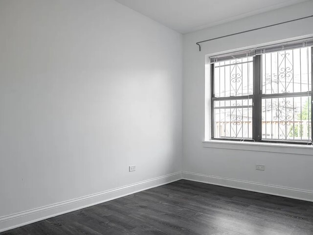 1524 North Ashland Avenue Chicago, IL 60622 - Photo 34 of 38 an empty room with wooden floor and windows