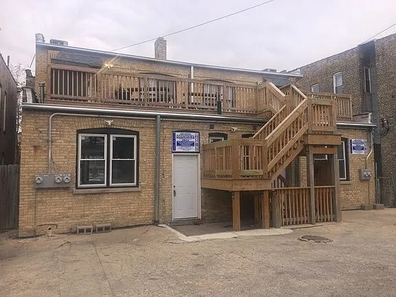 1524 North Ashland Avenue Chicago, IL 60622 - Photo 35 of 38 front view of a house with a balcony