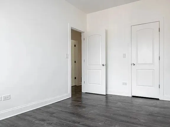 a kitchen with a refrigerator and a sink