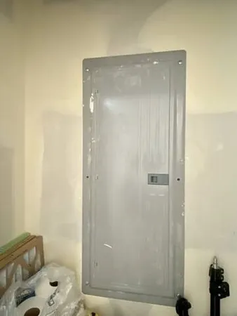 a bathroom with a glass shower door