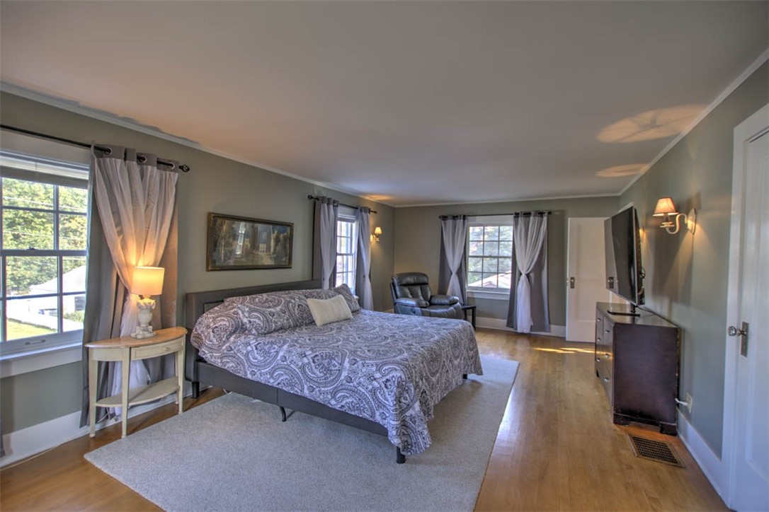 266 Cobb Avenue Decatur, IL 62522 - Photo 22 of 35 a spacious bedroom with a large bed and a window