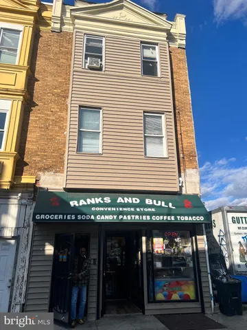 a view of a brick building with many windows