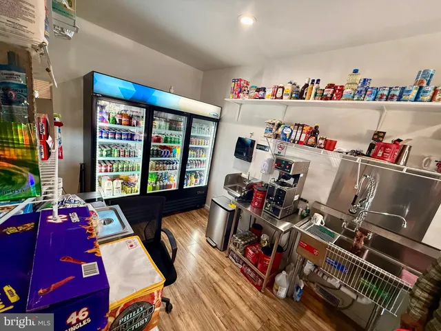 a room with gym equipment and a flat screen tv