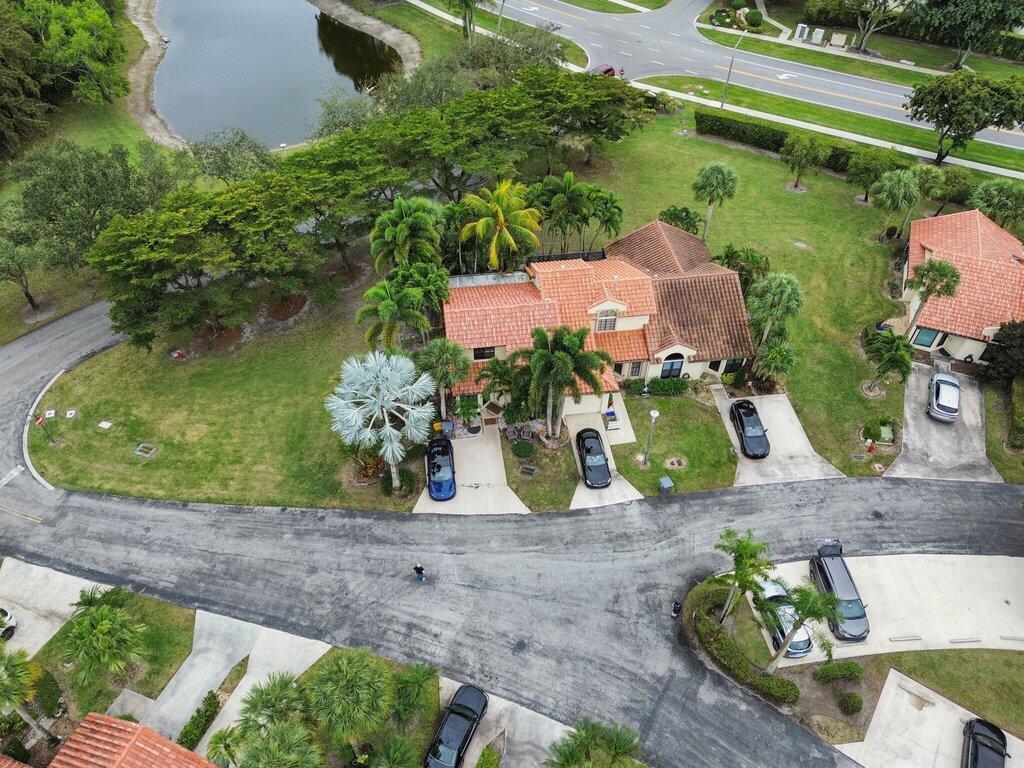 10272 Hidden Springs Court Boca Raton, FL 33498 - Photo 20 of 25 an aerial view of a house with a yard