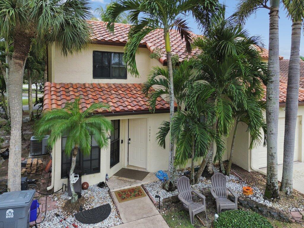 10272 Hidden Springs Court Boca Raton, FL 33498 - Photo 2 of 25 a front view of house with small garden