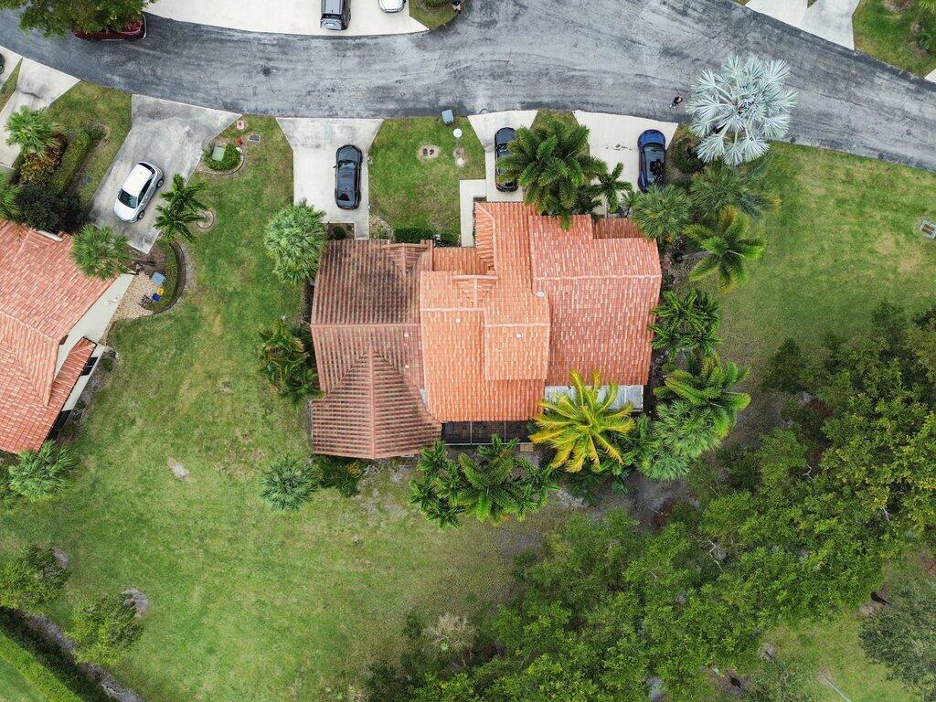 10272 Hidden Springs Court Boca Raton, FL 33498 - Photo 21 of 25 an aerial view of a house with a garden