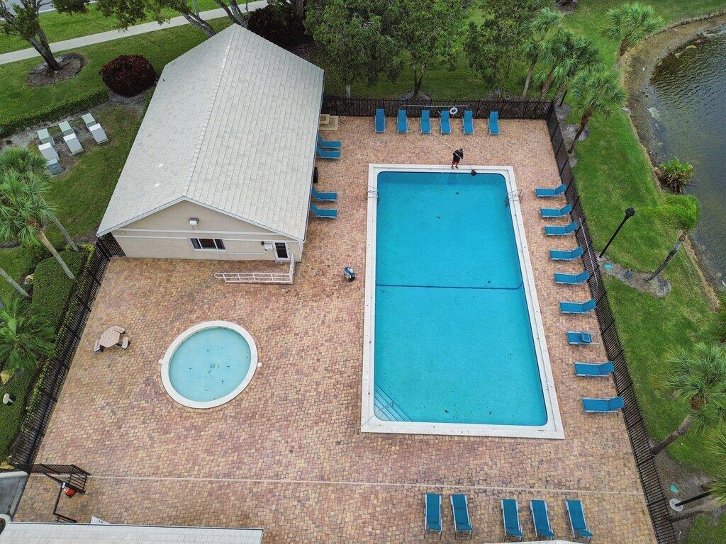 10272 Hidden Springs Court Boca Raton, FL 33498 - Photo 22 of 25 an aerial view of a house with a yard and trees