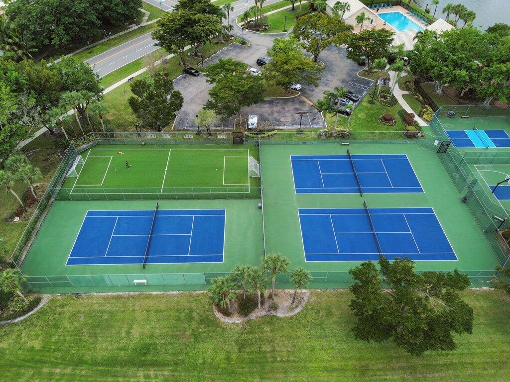 10272 Hidden Springs Court Boca Raton, FL 33498 - Photo 25 of 25 a green field with lots of trees in the background