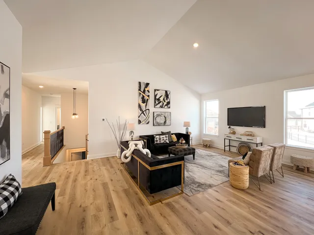 a living room with furniture flat screen tv and a fireplace