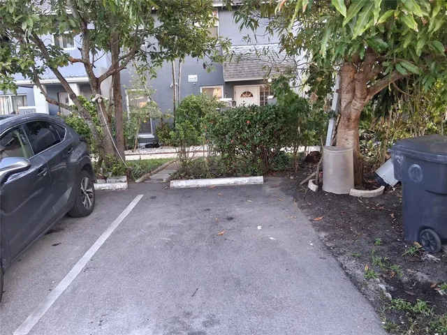 a view of a car park in front of a building