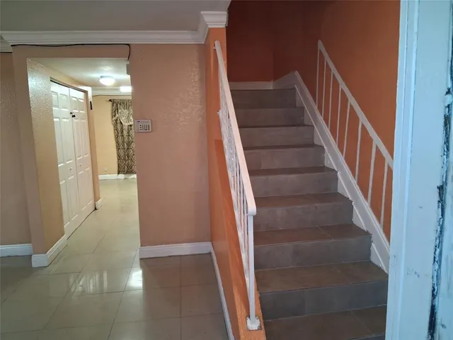 a view of a hallway with staircase