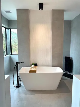 a white bath tub sitting in a bathroom