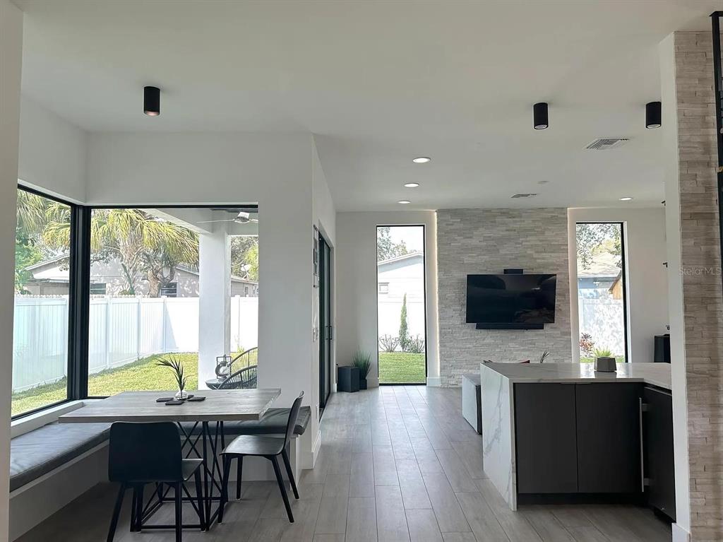 4217 West Arch Street Tampa, FL 33607 - Photo 8 of 22 a view of a livingroom with kitchen and furniture