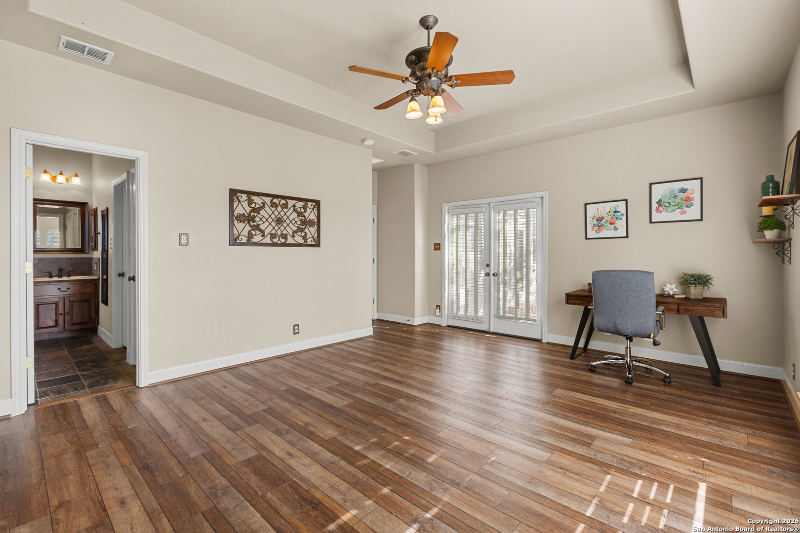 250 Misty Brook Spring Branch, TX 78070 - Photo 17 of 47 a view of a livingroom with wooden floor and a ceiling fan