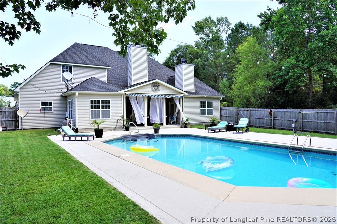 930 Old Vander Road Fayetteville, NC 28312 - Photo 37 of 45 a view of a house with swimming pool and sitting area