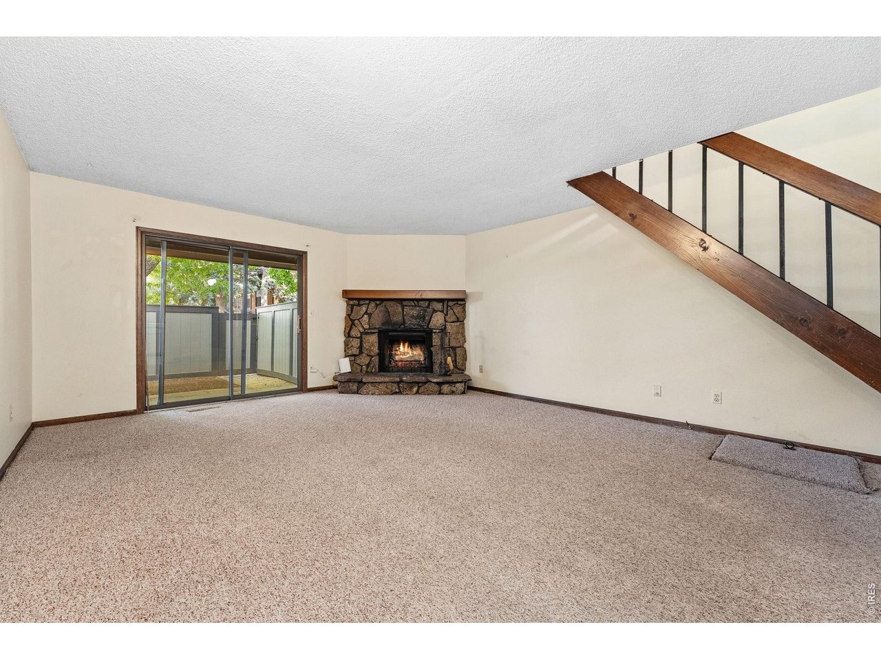 1325 Birch Street, Unit 12 Fort Collins, CO 80521 - Photo 12 of 26 a view of empty room with stairs and fan