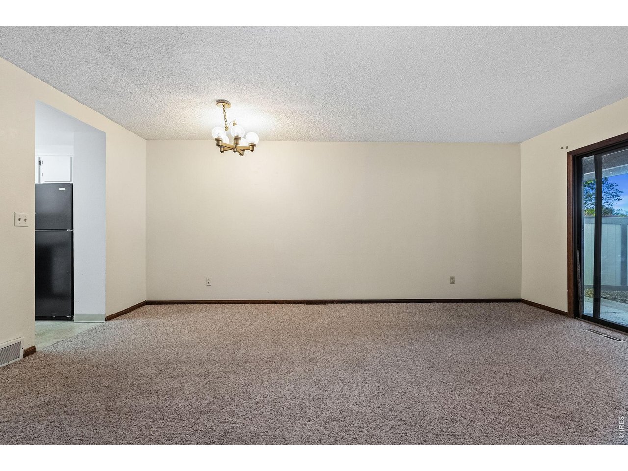 1325 Birch Street, Unit 12 Fort Collins, CO 80521 - Photo 13 of 26 a view of a room with a ceiling fan and window