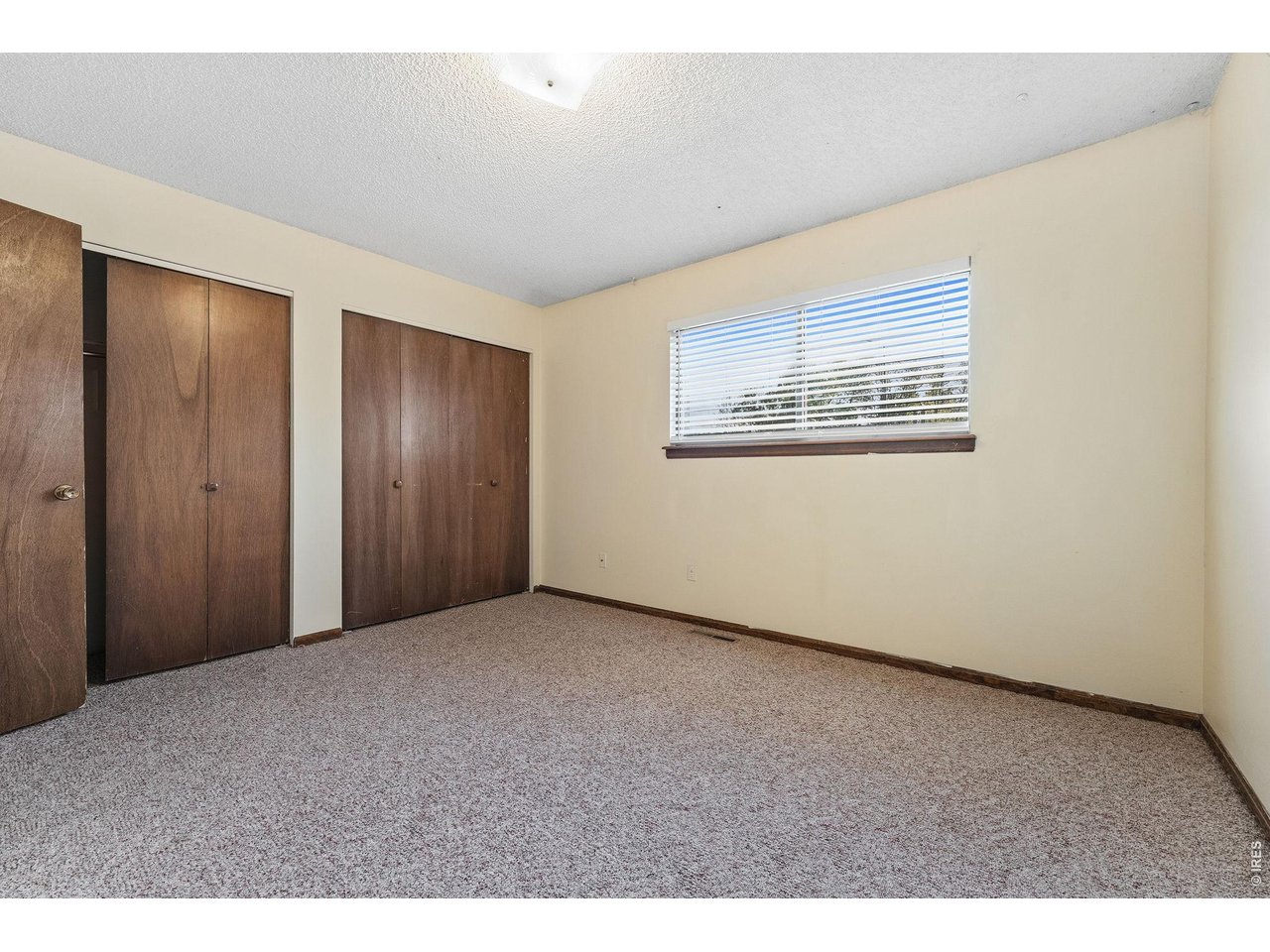 1325 Birch Street, Unit 12 Fort Collins, CO 80521 - Photo 19 of 26 a view of an empty room with a window