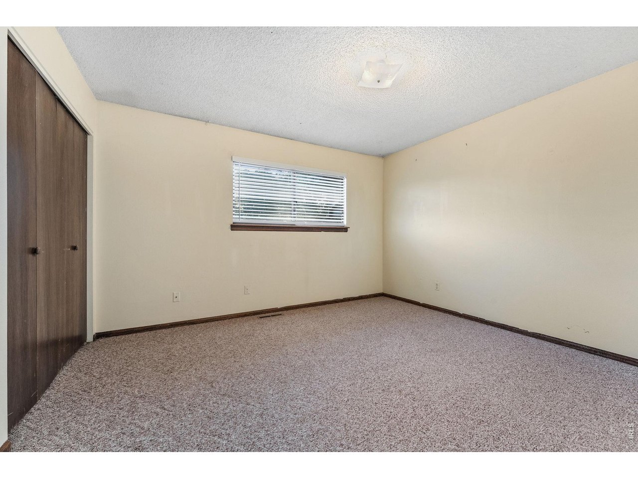 1325 Birch Street, Unit 12 Fort Collins, CO 80521 - Photo 20 of 26 a view of an empty room with a window