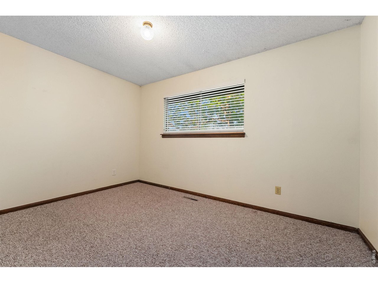 1325 Birch Street, Unit 12 Fort Collins, CO 80521 - Photo 24 of 26 a view of an empty room with a window