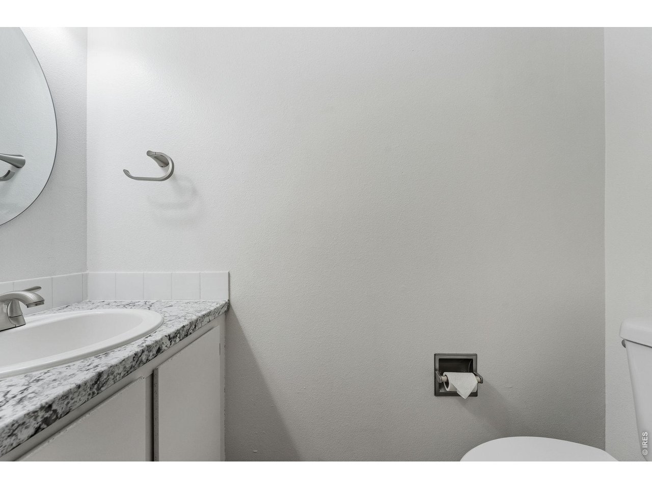 1325 Birch Street, Unit 12 Fort Collins, CO 80521 - Photo 9 of 26 a bathroom with a sink and mirror