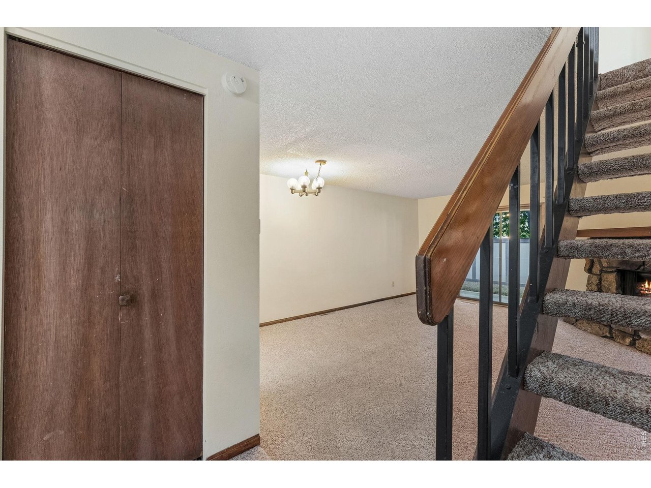 1325 Birch Street, Unit 12 Fort Collins, CO 80521 - Photo 10 of 26 a view of a hallway with wooden floor and staircase