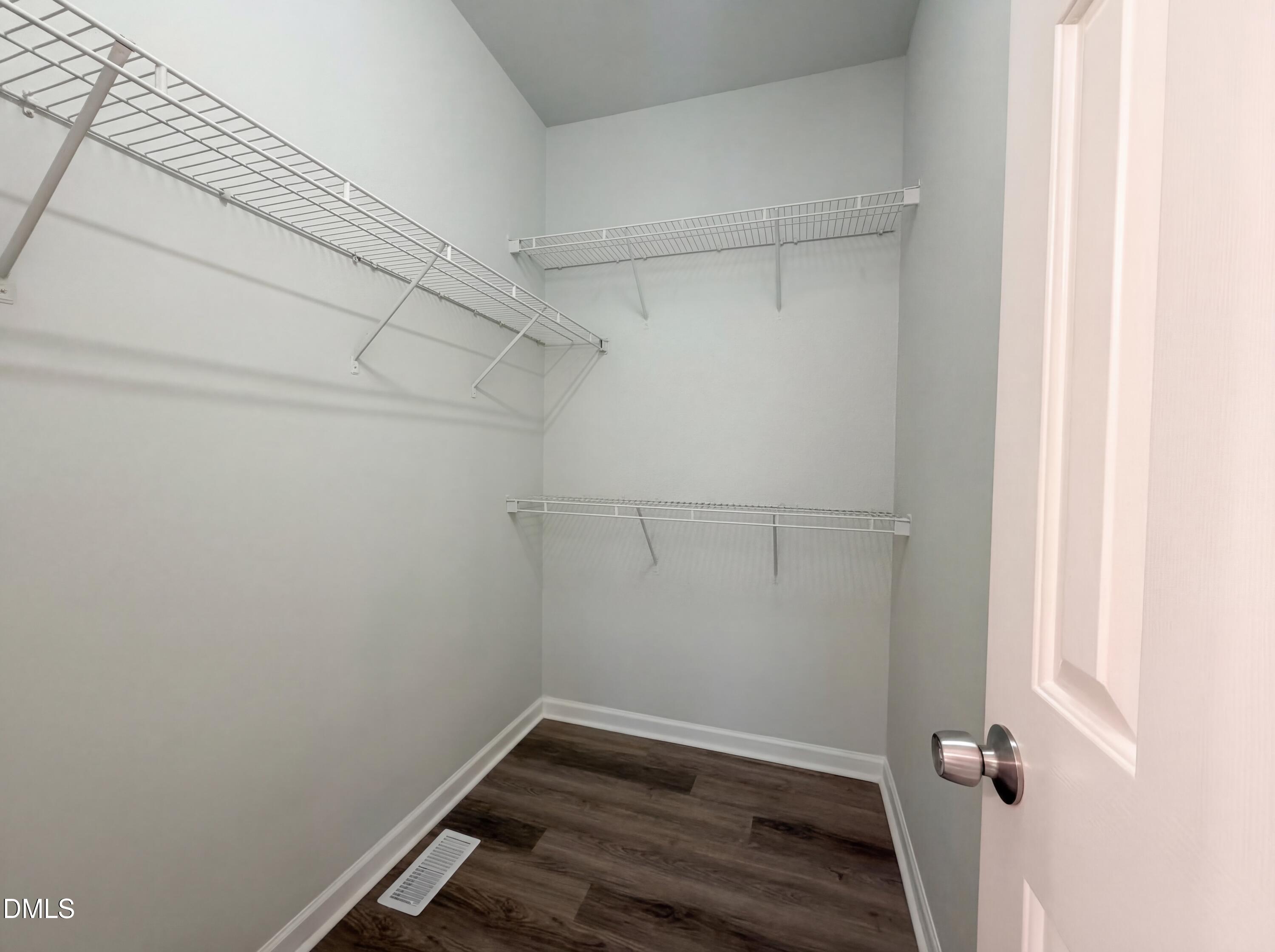 1071 Darius Pearce Road Youngsville, NC 27596 - Photo 16 of 22 a view of a room with racks on the wall