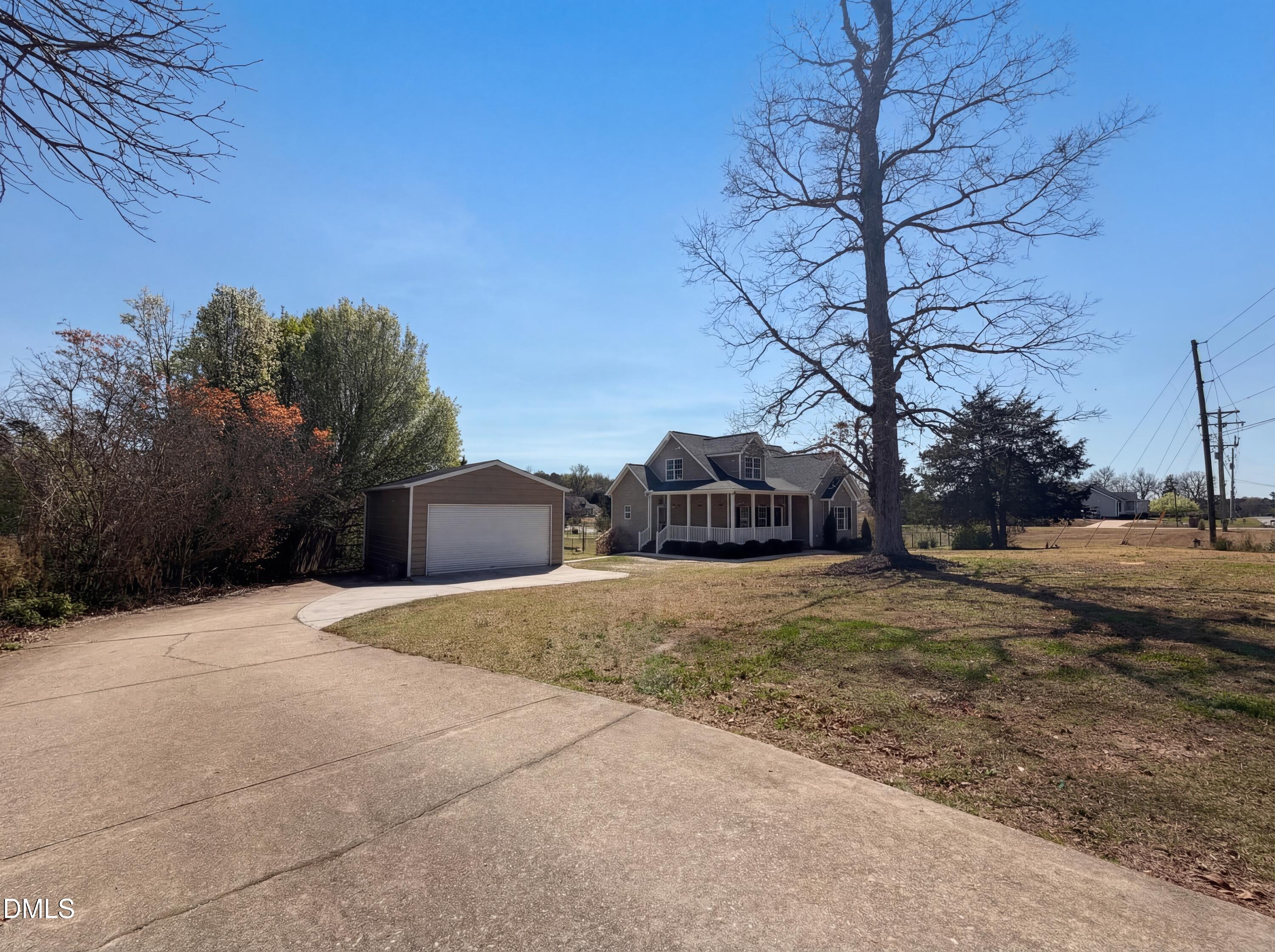 1071 Darius Pearce Road Youngsville, NC 27596 - Photo 18 of 22 a front view of a house with a yard and trees