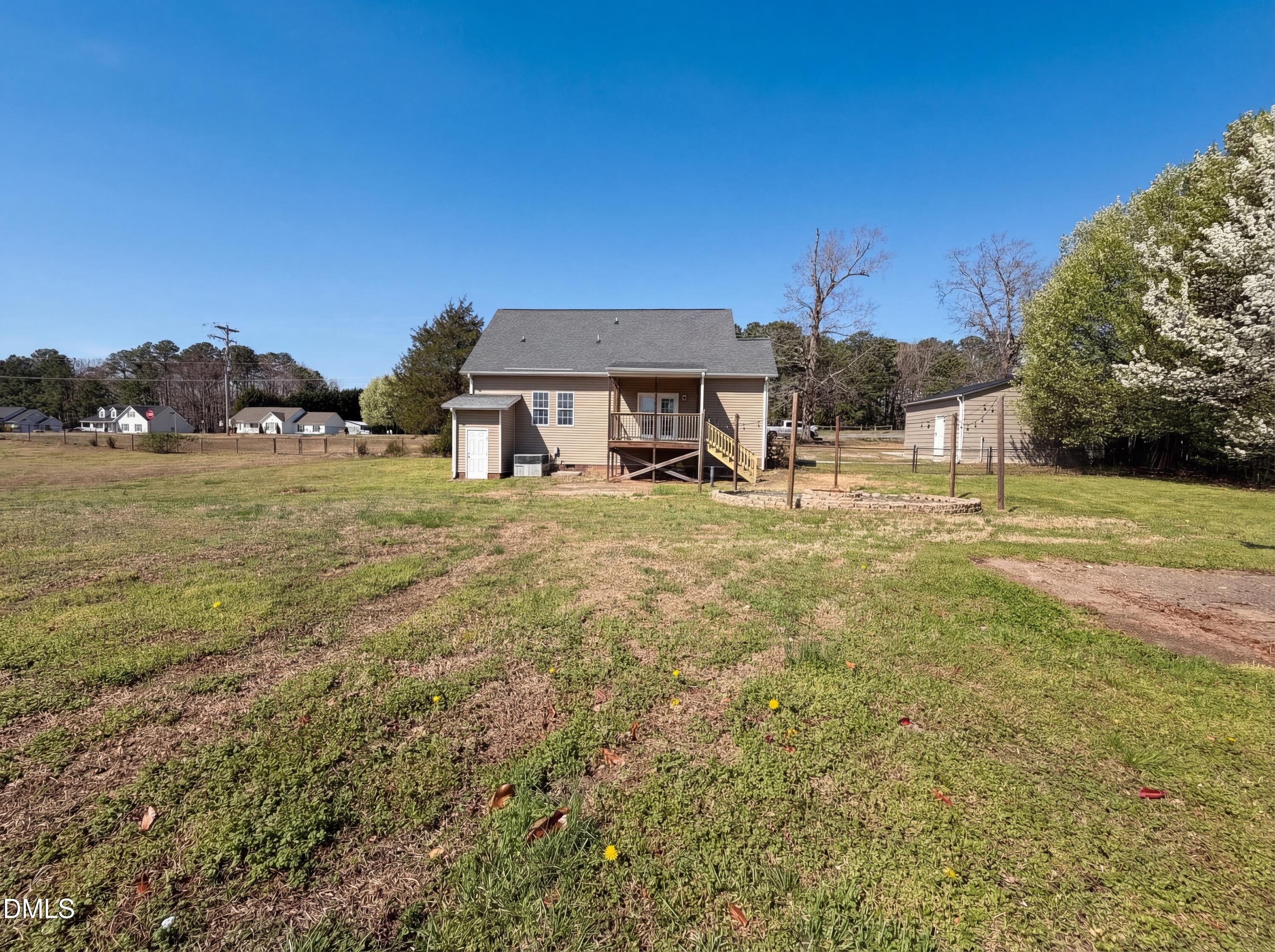 1071 Darius Pearce Road Youngsville, NC 27596 - Photo 22 of 22 a view of a house with a yard
