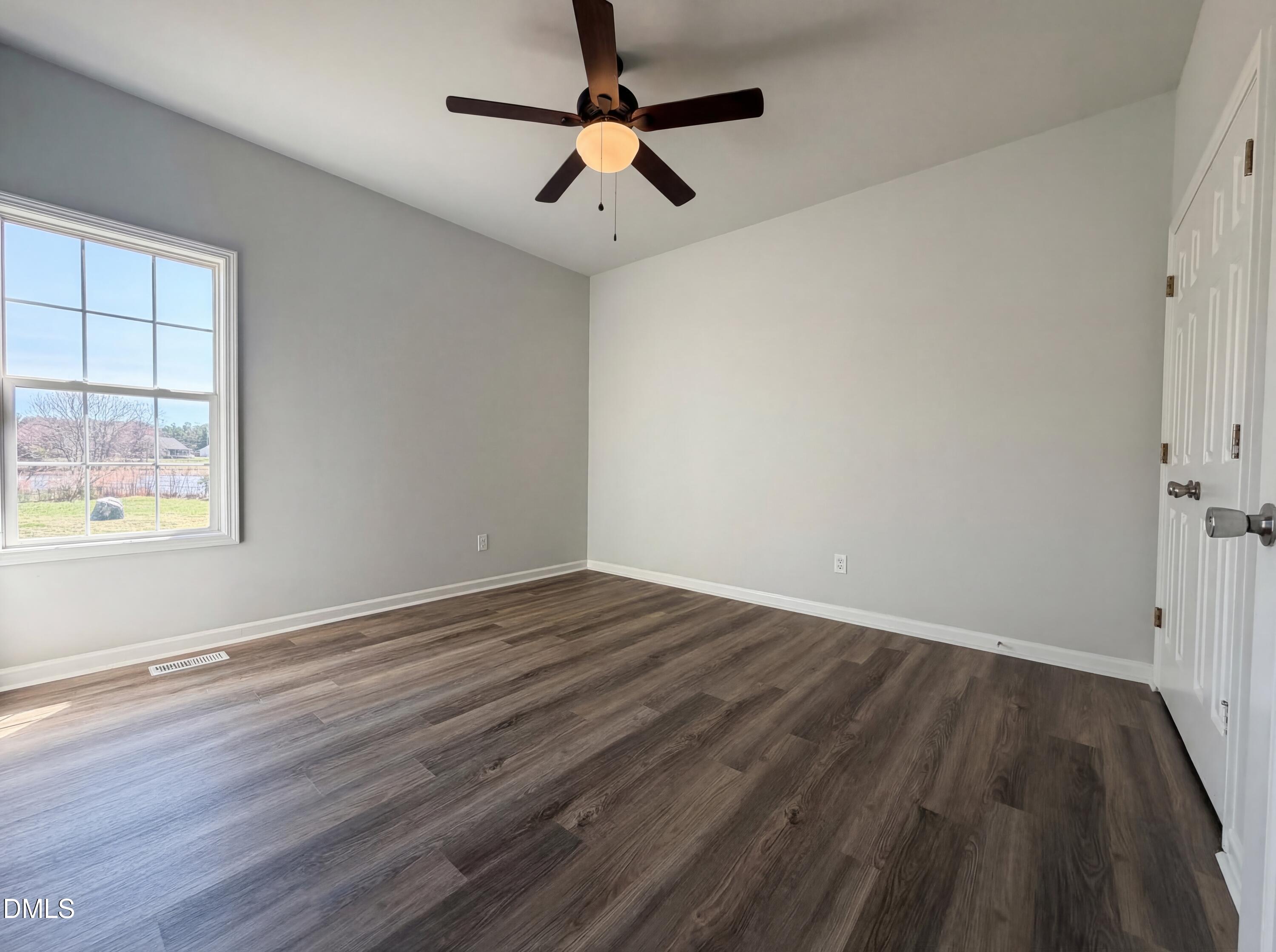 1071 Darius Pearce Road Youngsville, NC 27596 - Photo 8 of 22 wooden floor in an empty room with a window
