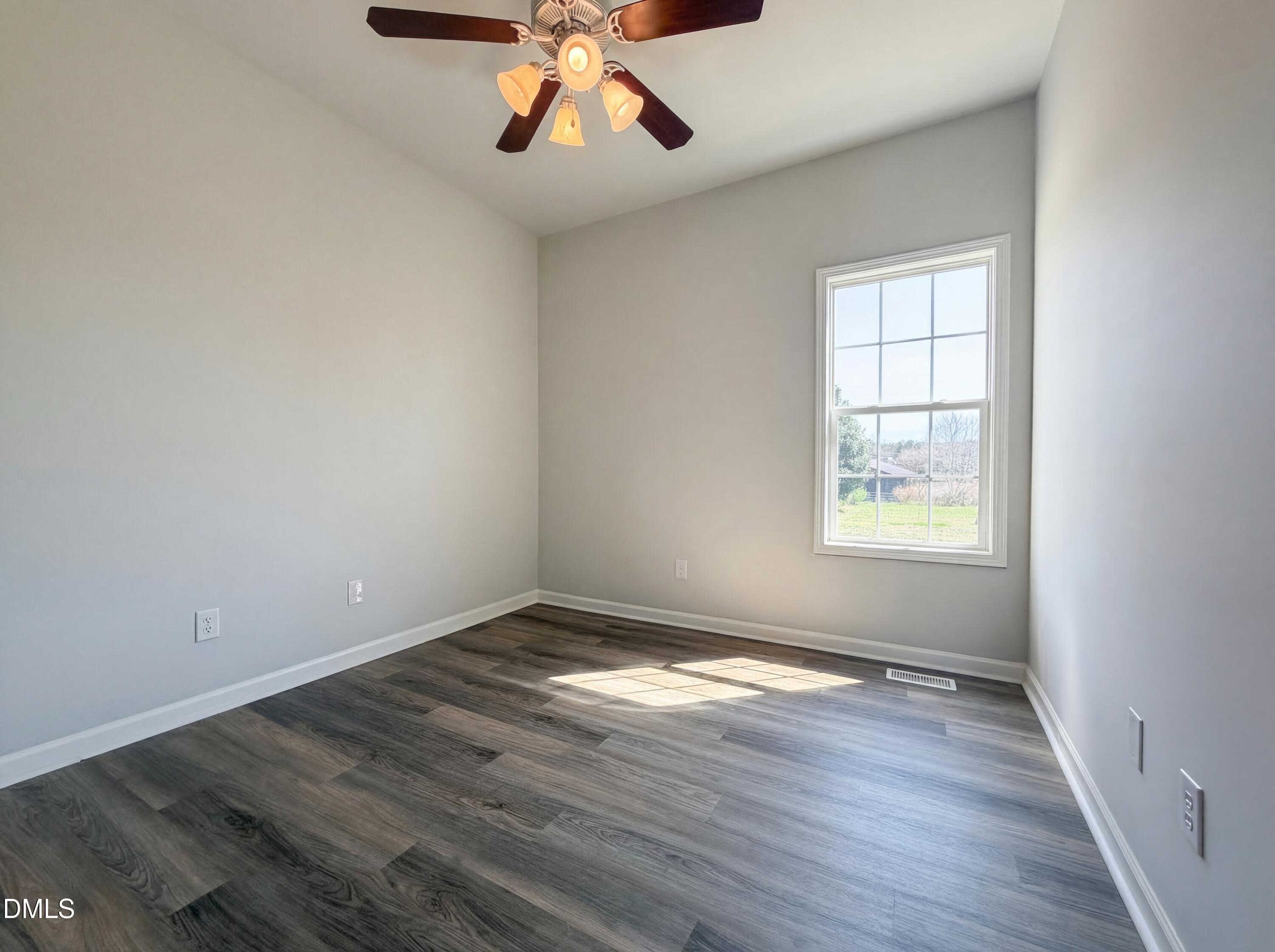 1071 Darius Pearce Road Youngsville, NC 27596 - Photo 9 of 22 wooden floor in an empty room with a window