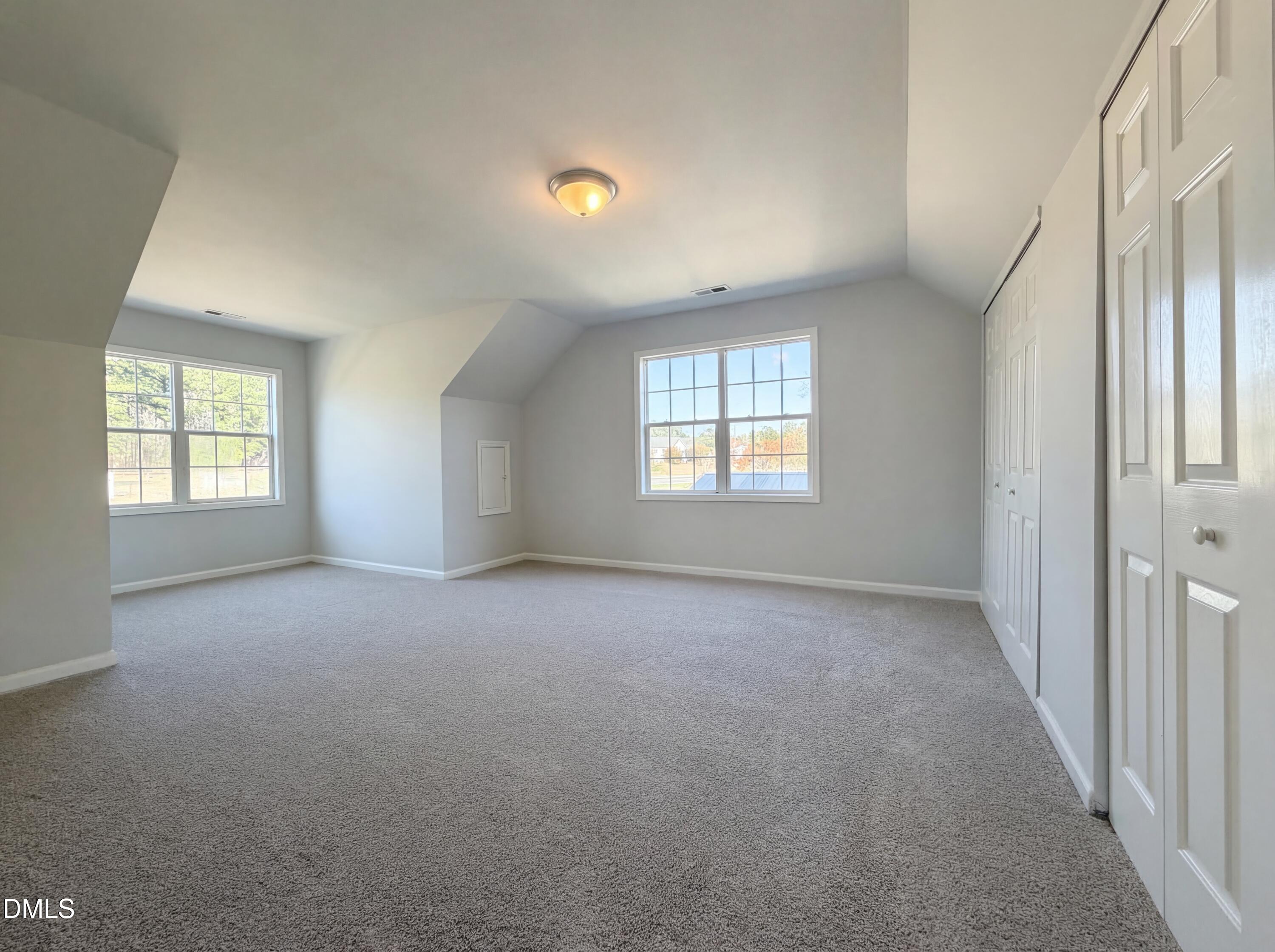 1071 Darius Pearce Road Youngsville, NC 27596 - Photo 10 of 22 an empty room with windows
