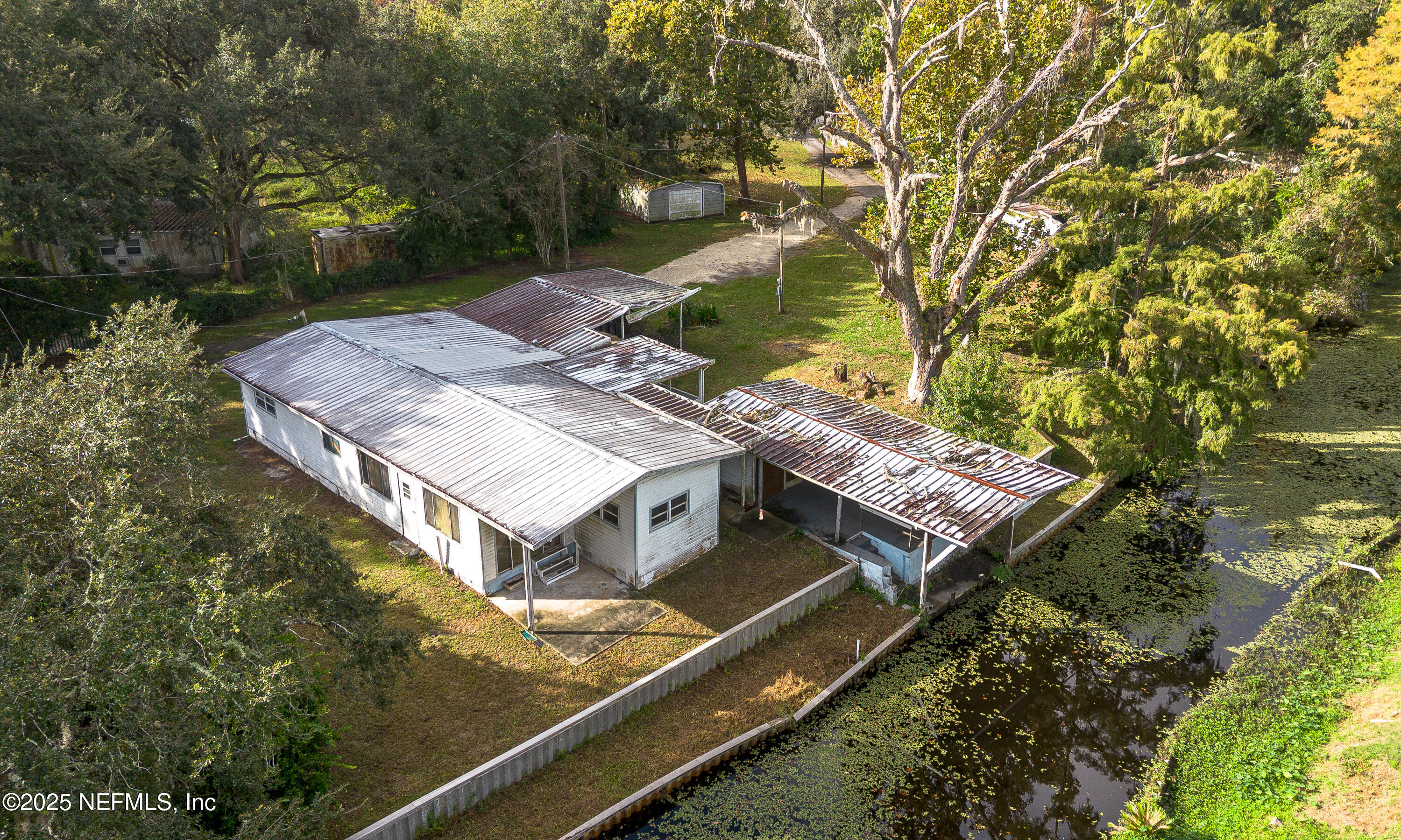 590 Palmetto Bluff Road Palatka, FL 32177 - Photo 12 of 13 an aerial view of a house with a yard