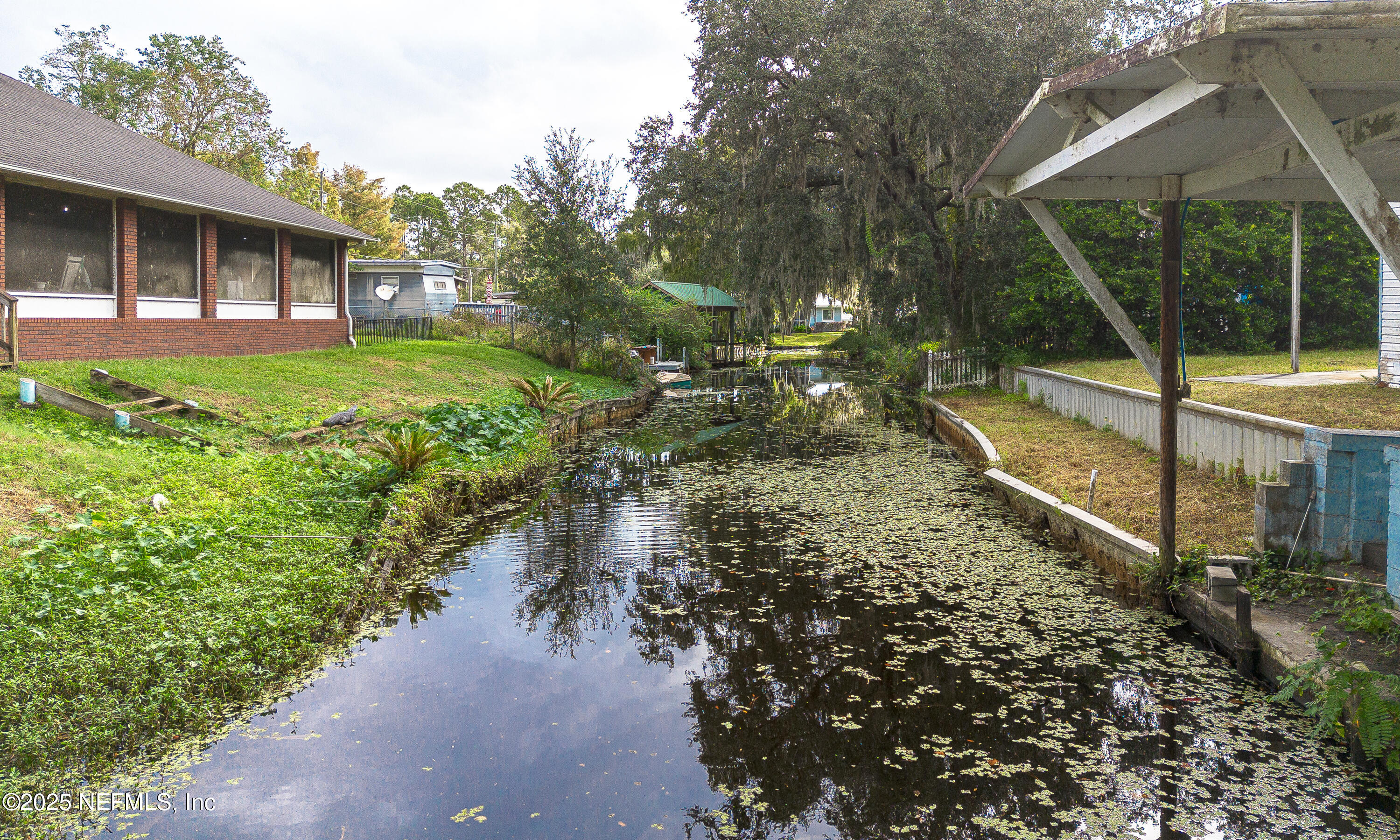 590 Palmetto Bluff Road Palatka, FL 32177 - Photo 6 of 13 a view of a house with backyard