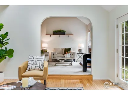 a view of a porch with furniture and garden