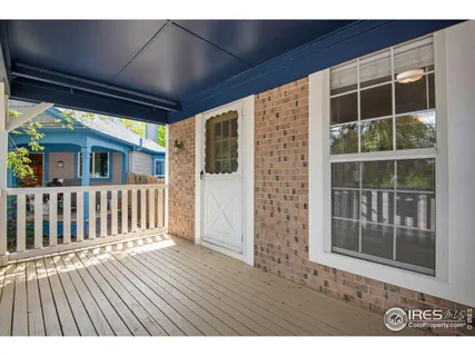 a view of porch with wooden floor