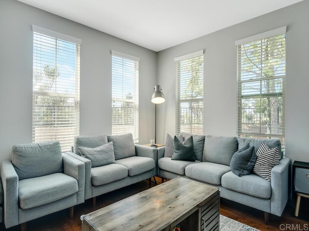 11170 Taloncrest Way, Unit 57 San Diego, CA 92126 - Photo 1 of 31 a living room with furniture and windows