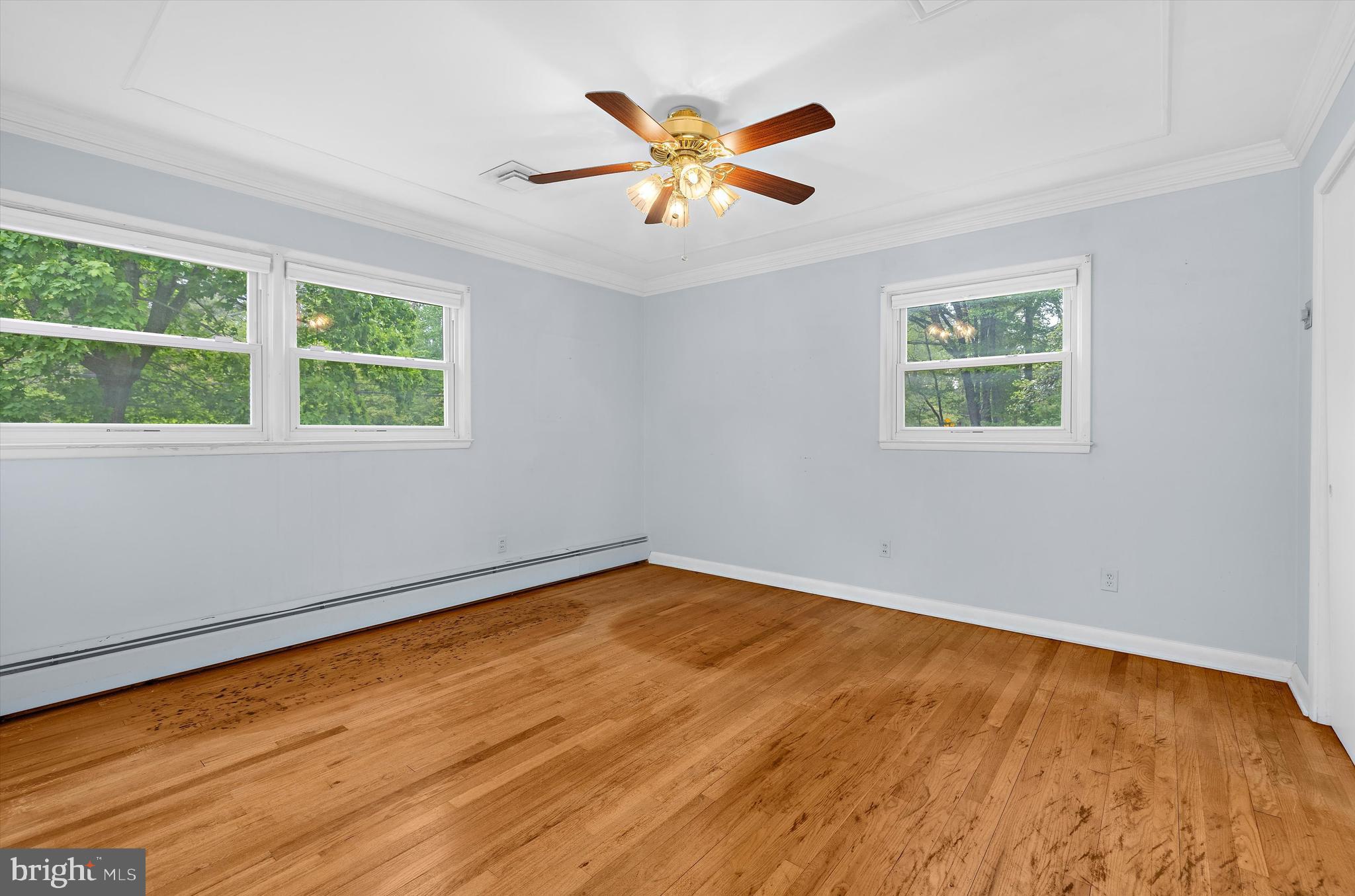 1159 Dicus Mill Road Millersville, MD 21108 - Photo 20 of 81 a view of an empty room with wooden floor and a window