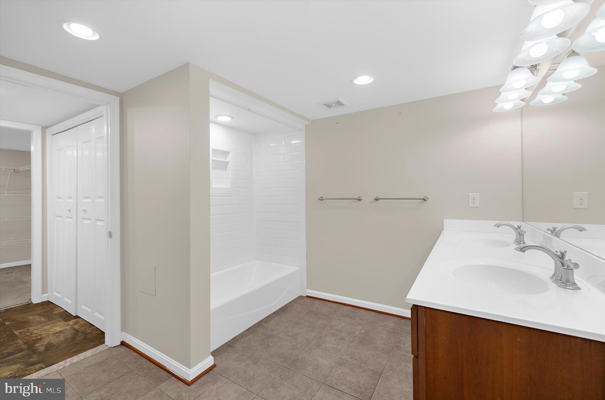 1159 Dicus Mill Road Millersville, MD 21108 - Photo 46 of 81 a bathroom with a sink and a mirror