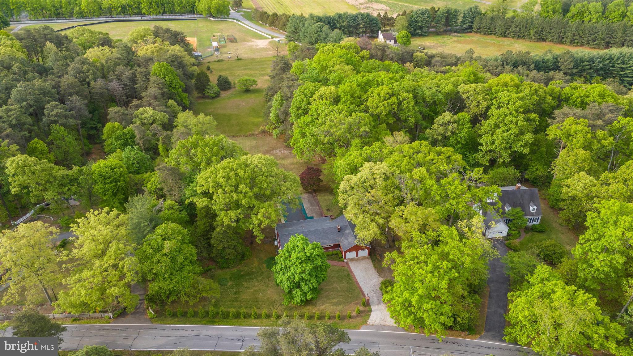 1159 Dicus Mill Road Millersville, MD 21108 - Photo 72 of 81 an aerial view of residential houses with outdoor space and trees