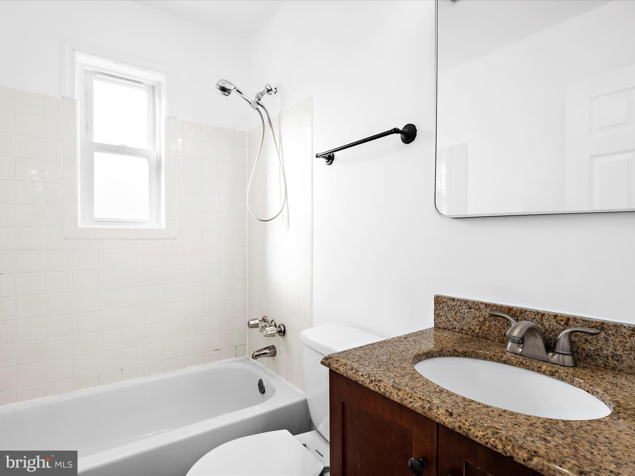 400 Dale Avenue Baltimore, MD 21206 - Photo 14 of 27 a bathroom with a granite countertop sink mirror toilet and bathtub