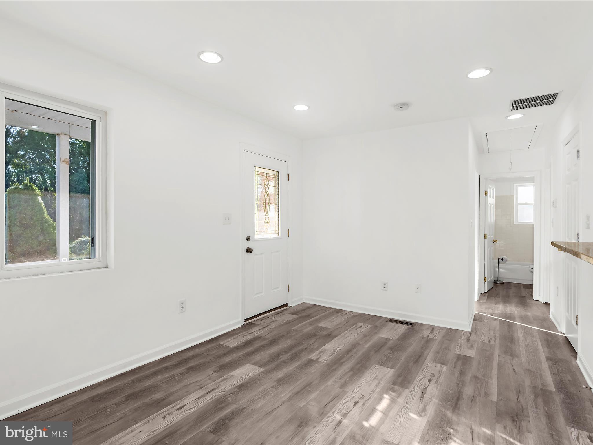 400 Dale Avenue Baltimore, MD 21206 - Photo 3 of 27 a view of empty room with wooden floor and fan