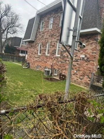 a aerial view of a house with a yard