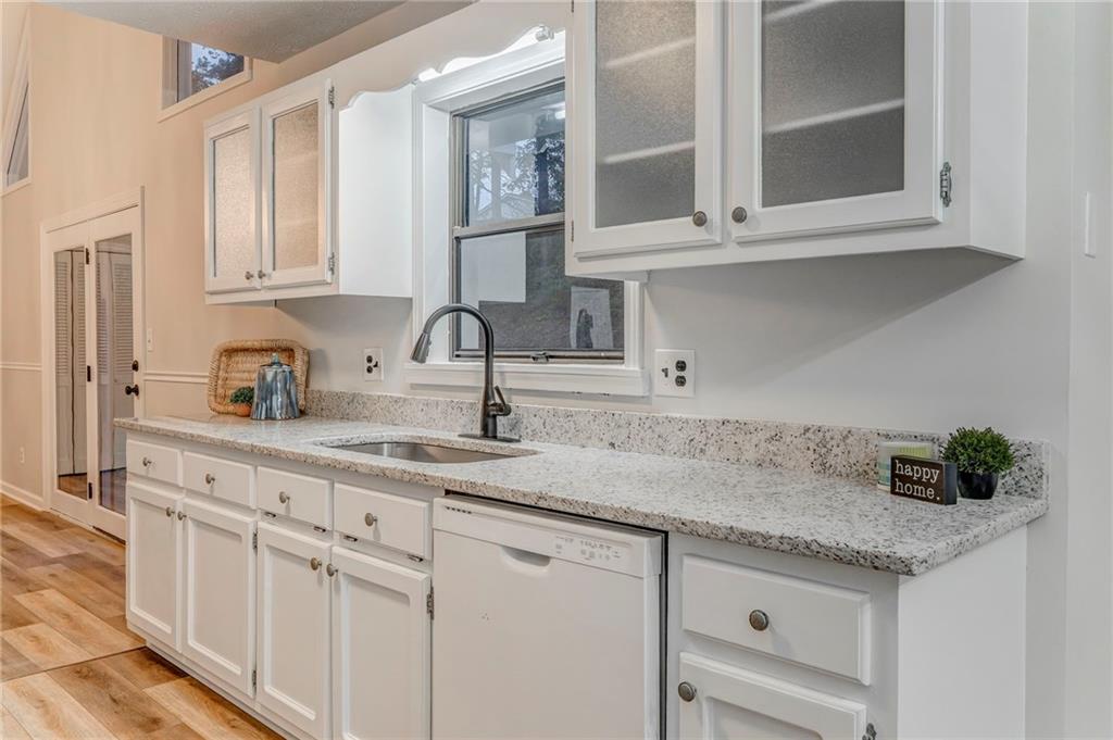 10 Thornwood Drive Southwest Rome, GA 30165 - Photo 13 of 57 a kitchen with white cabinets and a sink