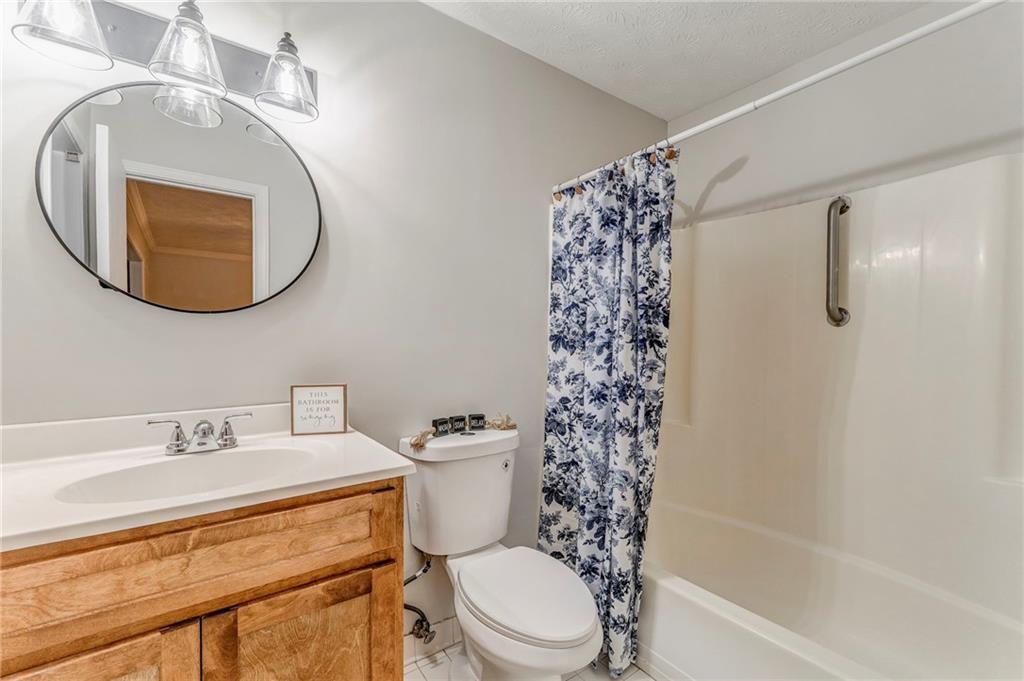 10 Thornwood Drive Southwest Rome, GA 30165 - Photo 30 of 57 a bathroom with a sink a toilet and a mirror